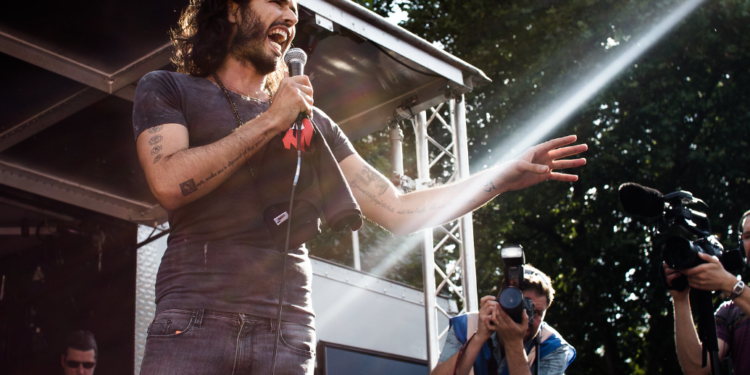 Russell Brand’s Demonetization Is Not a Bug of the Emerging Financial Order, but a Feature